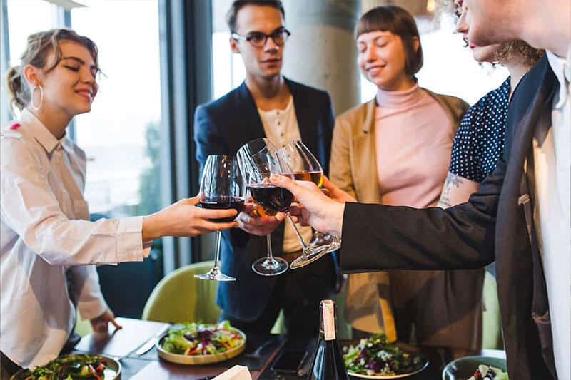 Colleagues toasting wine glasses